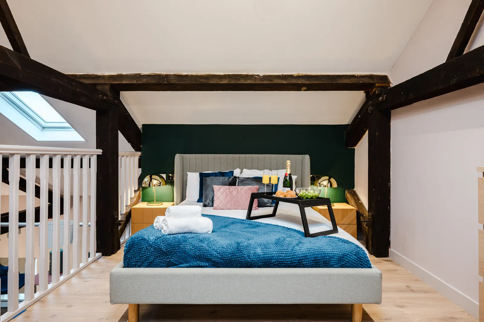 Central Manchester serviced apartment loft bedroom with skylight and exposed beams